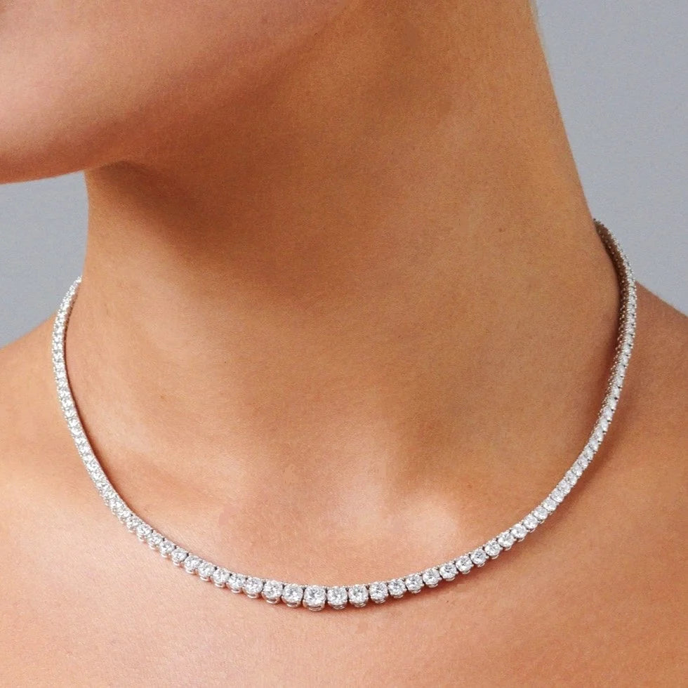 Full diamond tennis necklace worn on neck, 40 cm graduated round diamonds in 18K gold