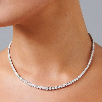 Full diamond tennis necklace worn on neck, 40 cm graduated round diamonds in 18K gold