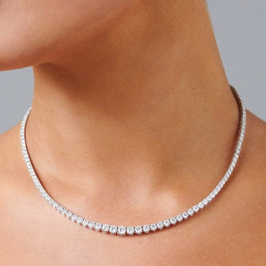 Full diamond tennis necklace worn on neck, 40 cm graduated round diamonds in 18K gold