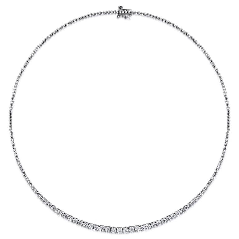 Graduated round diamonds in four-claw setting, half tennis necklace close-up, 18K gold